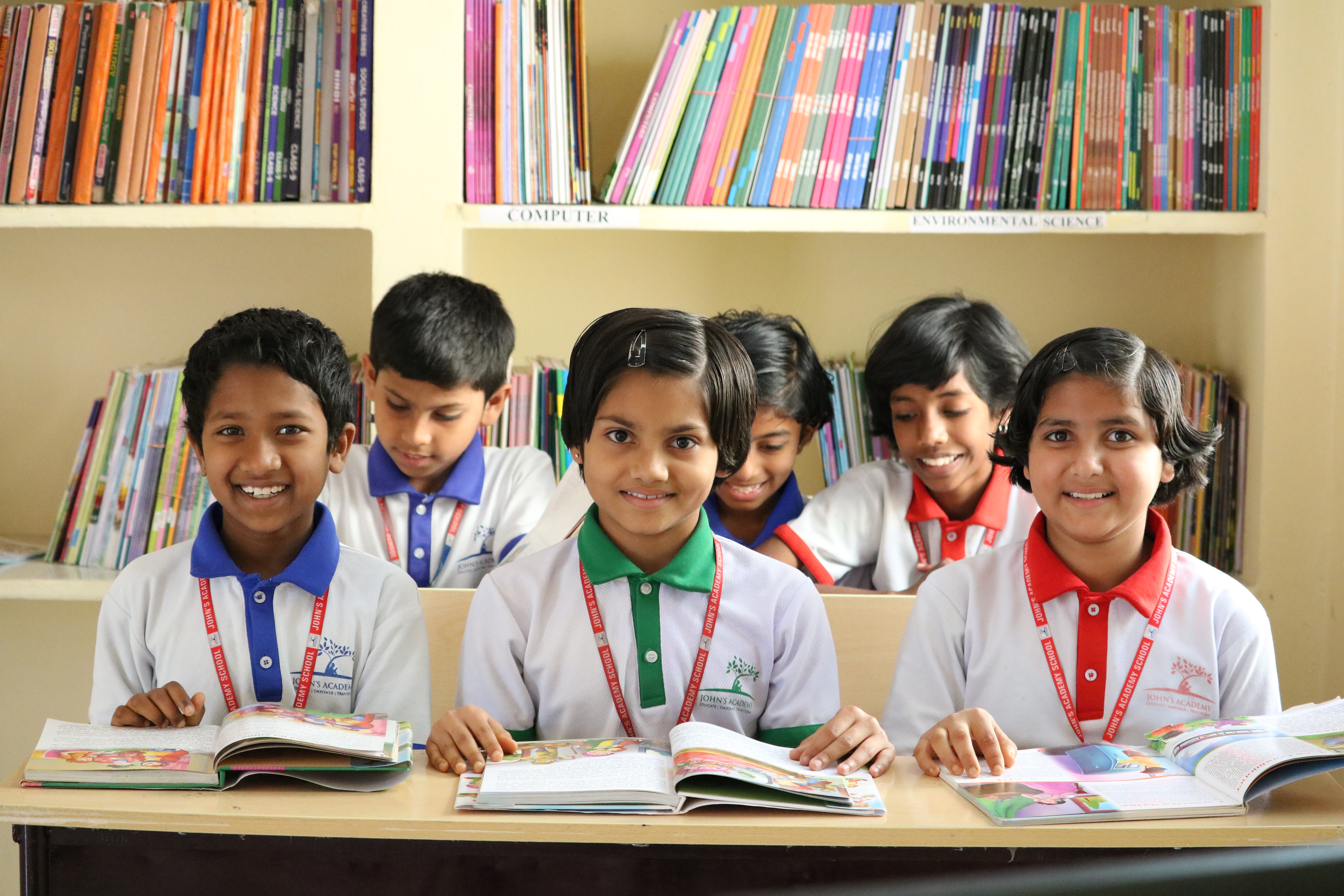 John's Academy students reading books in the school library