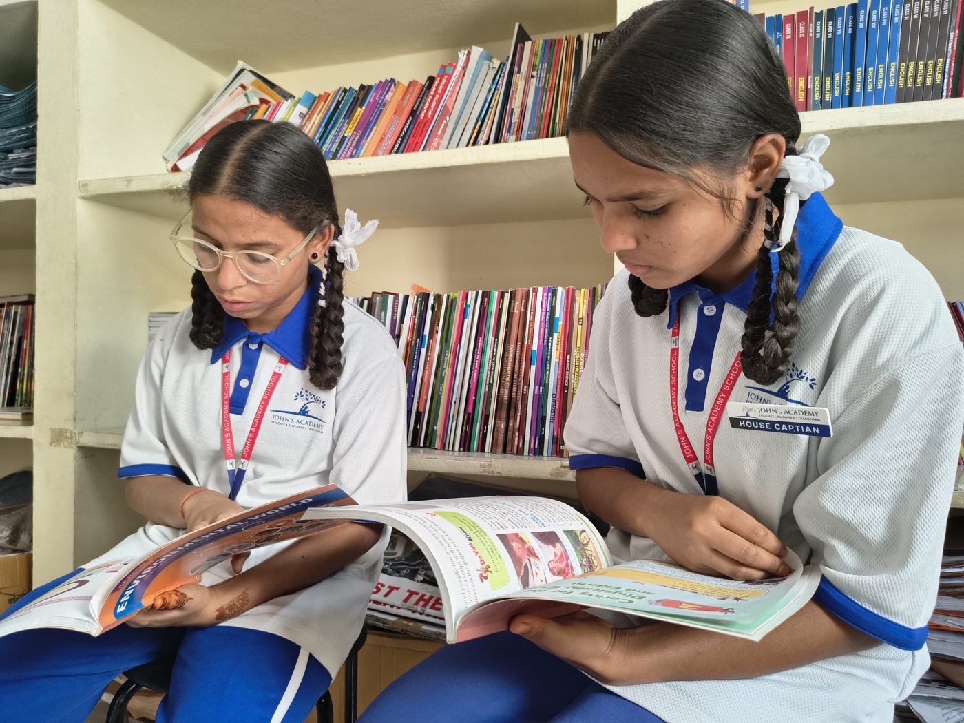 John's Academy students reading books in the school library